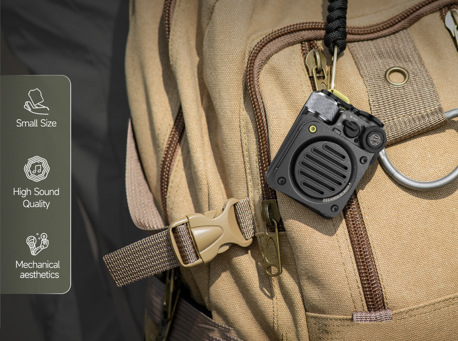 A mini portable speaker hanging on a bagpack for playing backgroun music all the time, this makes it a great productivity tool for digital nomads